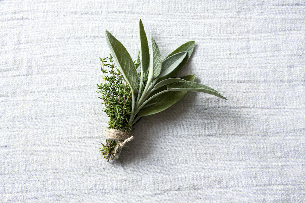 FemFarmed culinary herb bundle on tea towel