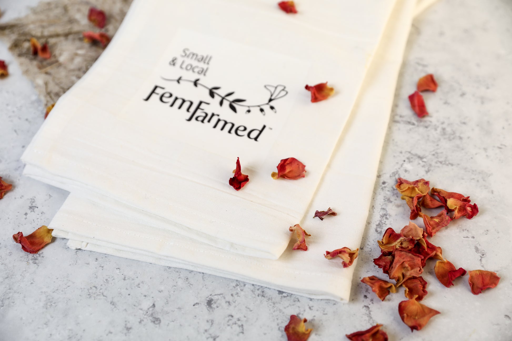 Flour sac tea towel FemFarmed logo with rose petals